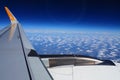 Aircraft engine and wing on the border of atmosphere and space. The edge of the troposphere. Horizon over the Earth