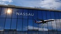 Airplane landing at Nassau Bahamas airport mirrored in terminal