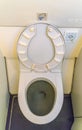 Aircraft lavatory toilets aboard a jetliner airplane .