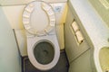 Aircraft lavatory toilets aboard a jetliner airplane .