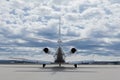 Aircraft learjet Plane in front of the Airport with cloudy sky