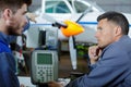 Aircraft maintenance mechanic inspects plane chassis Royalty Free Stock Photo