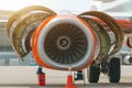 Aircraft Maintenance Mechanics Inspecting and Working on Airplane Jet Engine on Apron. Royalty Free Stock Photo