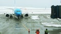 Ground Crew Signaling To Airplane After Landing at Ushuaia Airport, Tierra del Fuego Province, Argentina, South America.