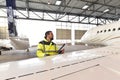 Aircraft mechanic inspects and checks the technology of a jet in Royalty Free Stock Photo