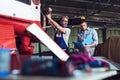 Aircraft mechanics in the hangar. Coworkers repairing an aircraft