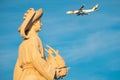 Aircraft passing behind the head of Henry The Navigator Lisbon