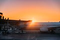 Aircraft Plane Boarding Passengers In Airport In Sunny Sunset Su Royalty Free Stock Photo