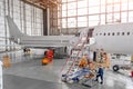 Aircraft during repair, technical inspection is a working technician. View of nose, a cockpit with a staircase leading into the en