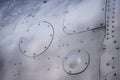 Aircraft skin close up. Rivets on gray metal Royalty Free Stock Photo