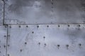 Aircraft skin close up. Rivets on gray metal Royalty Free Stock Photo