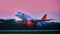 Aircraft Sukhoi Superjet 100 RA-89136 Azimut airlines takes off in airport Platov. takeoff against the sunset sky. Spotting at the Royalty Free Stock Photo