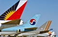 Aircraft tails at John F Kennedy International Airport , KJFK Taken on June 1 , 1999 . Korean Airlines , Asiana Airlines