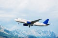 Aircraft take off. Mountains view.