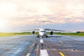 Aircraft taxis before take off in the evening at sunset at the airport. Royalty Free Stock Photo