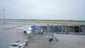 Aircraft technician checks detaching of the airbridge from the airplane before flying.