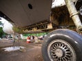 Aircraft Tires Under Repair on an Old Junkyard. Rusty and Broken Retractable Hydraulically Operated Airplane Wheel. Royalty Free Stock Photo