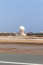 Aircraft tracking radar tower at Muscat airport. Runway and tarmac at Muscat airport at day. Sultanate of Oman Royalty Free Stock Photo