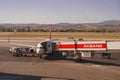 Aircraft of Turkish Airlines by gate and uploud of luggage in Esenboga International Airport in Ankara