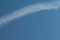 Aircraft vapour trail and moon in the sky of Gran Canaria. Royalty Free Stock Photo