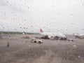 Aircraft Window with plane with rainy window and raindrops