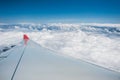 Aircraft wing above clouds Royalty Free Stock Photo