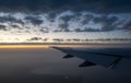 Aircraft wing and dramatic sunset clouds Royalty Free Stock Photo