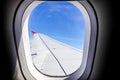 Aircraft wing flying view from the airplane window in the morning. Traveling concept. Royalty Free Stock Photo