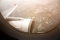 Aircraft wing flying view from window of China city in the morning. Traveling concept. Wing of an aircraft