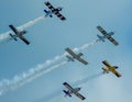 Aircrafts in a formation flight in the blue sky at an airshow