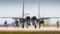 Aircrew arming F15 fighter jet Royalty Free Stock Photo