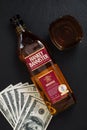 Hankey Bannister blended Scotch whisky bottle, glass and pile of 100 dollar bills