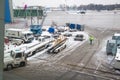 Airdrome machines under plane wing on winter.