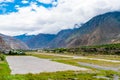 The airfield track of Jomsom airport with Annapurna peaks in the background Royalty Free Stock Photo