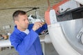 Airframe mechanic inside hangar Royalty Free Stock Photo