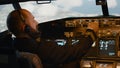 Airline captain fixing altitude and longitude to fly airplane