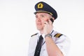 Airline captain pilot talking on the phone