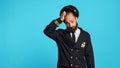 Airline captain raising shoulders and being unsure Royalty Free Stock Photo