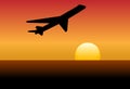 Airline jet silhouette takeoff into sunset or dawn