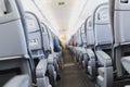 Airline passenger seats and aisle in airplane Royalty Free Stock Photo