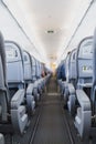 Airline passenger seats and aisle in airplane Royalty Free Stock Photo