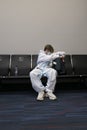 Airline Passenger wearing Face Mask and Hazmat Suit During the Coronavirus COVID-19 Pandemic in April 2020