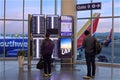 Airline passengers at a Southwest departure gate