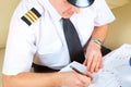 Airline pilot filling in papers in ARO Royalty Free Stock Photo