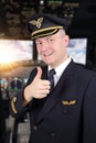 Airline pilot showing thumbs up