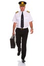 Airline pilot walking carrying flight case. Royalty Free Stock Photo