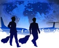 Airline pilots with luggage in airport Royalty Free Stock Photo