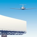 Airliner flying over billboard Royalty Free Stock Photo