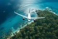 airliner flying in the sky above tropical island, travel and holidays concept Royalty Free Stock Photo