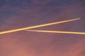 Airliner at high altitude with condesation trails. Royalty Free Stock Photo